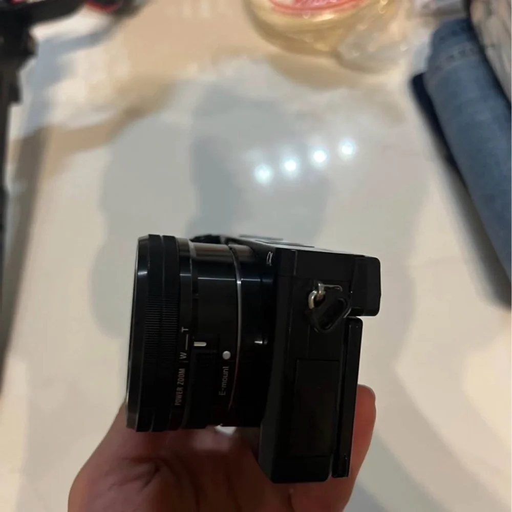Sony a6000 used with lens and battery and cable charger,bag the price is firm